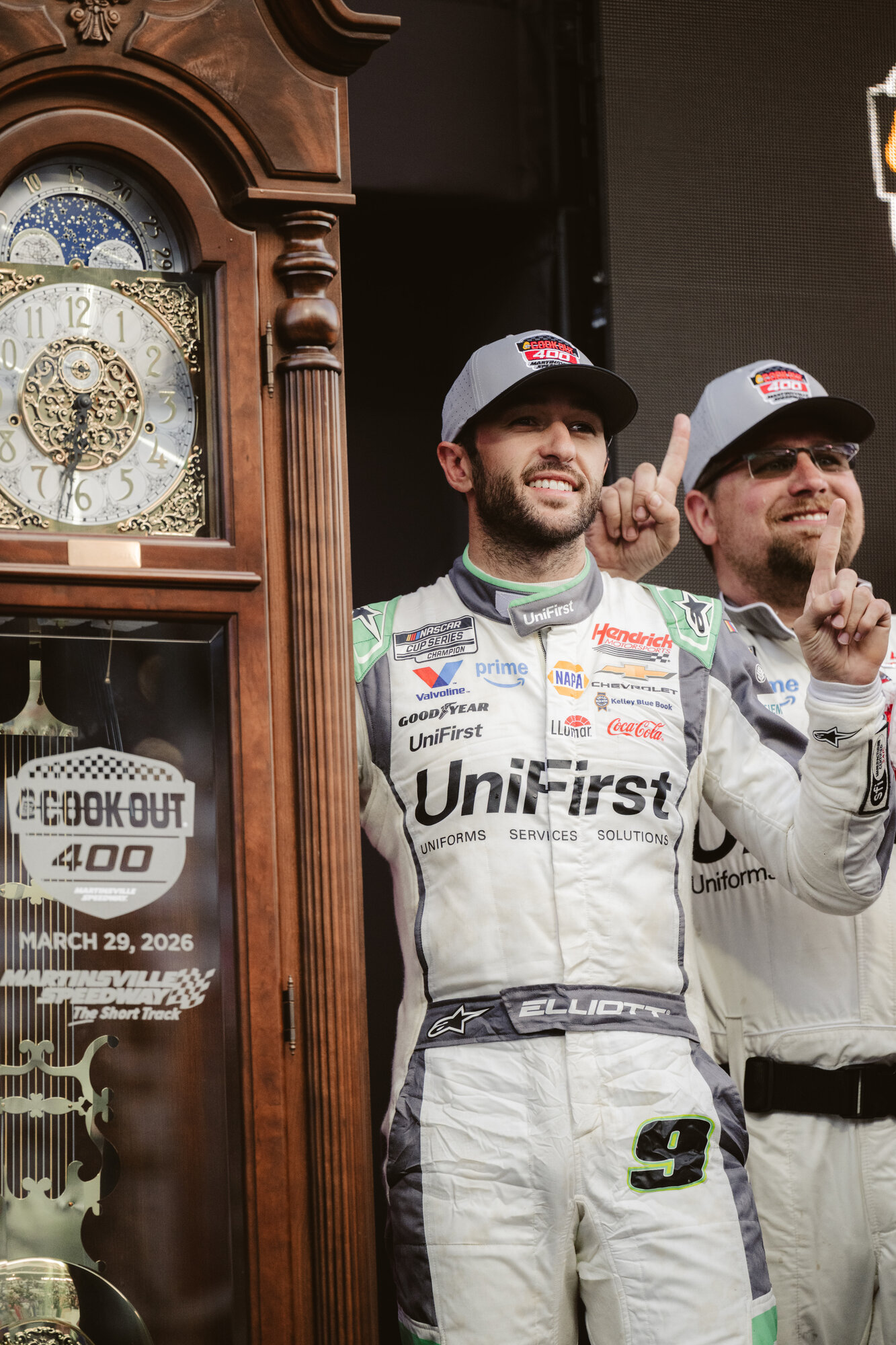 Chase Elliott celebrates with the Martinsville grandfather clock trophy