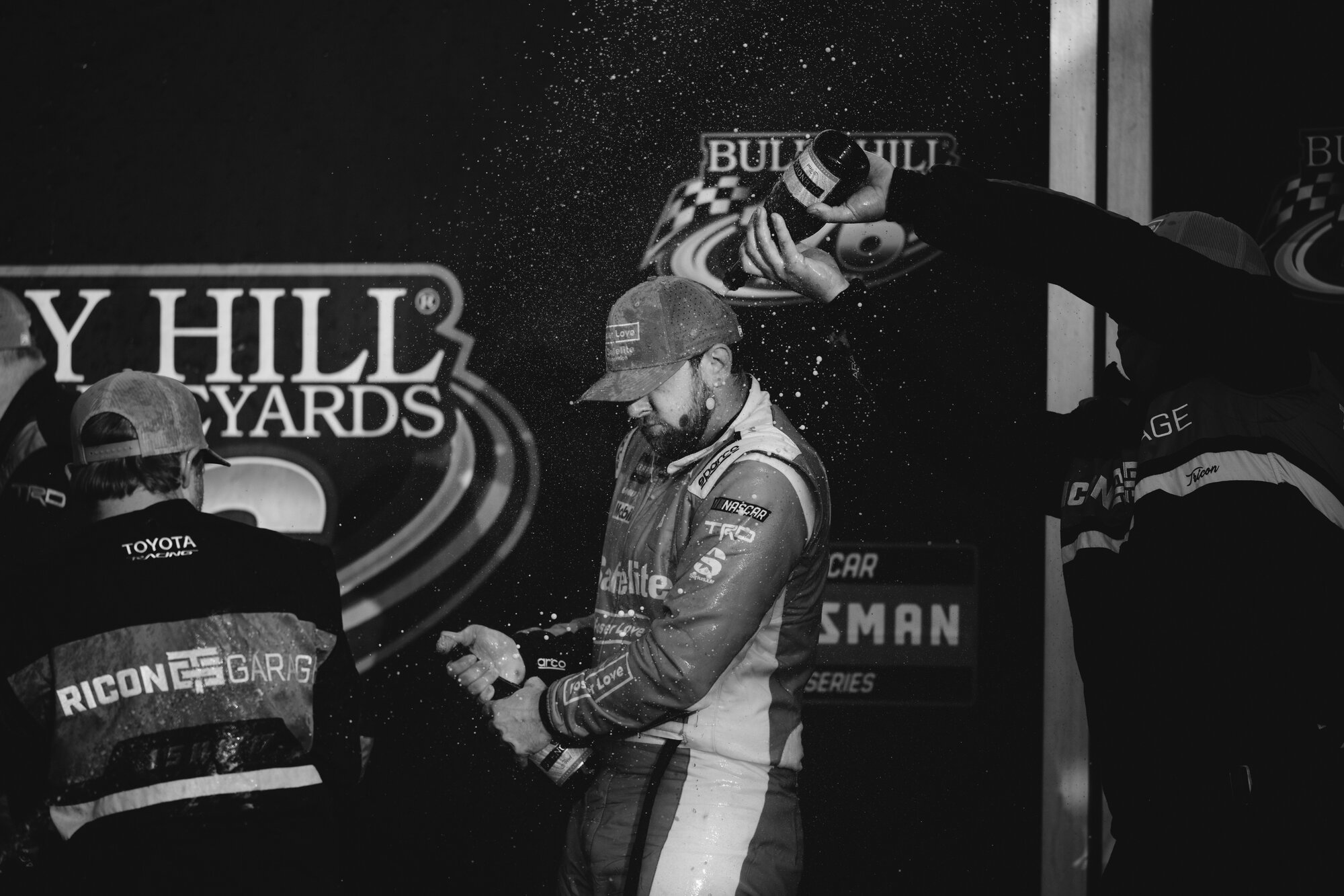 Kaden Honeycutt celebrates with his team in victory lane at Watkins Glen