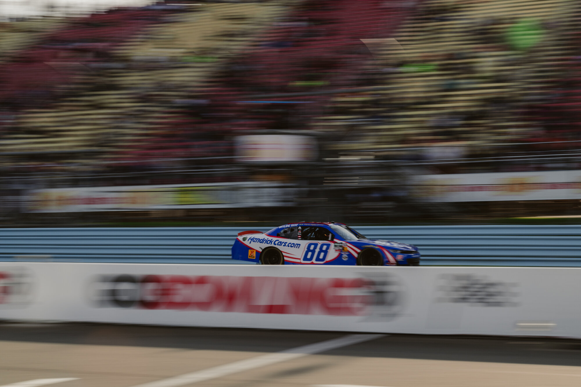 A car races through Watkins Glen International's esses