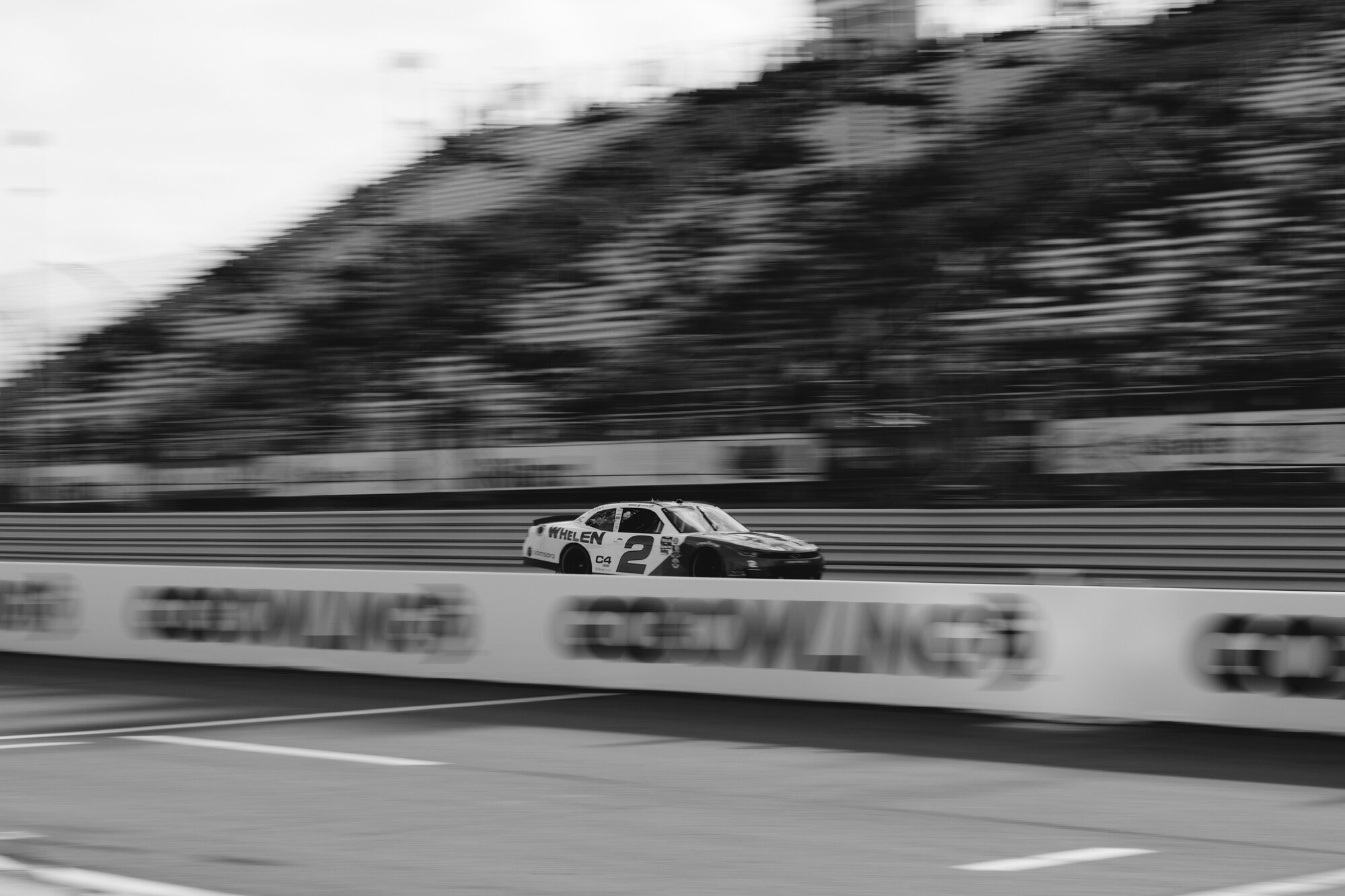 NASCAR O'Reilly Auto Parts Series cars race through a turn at Watkins Glen International