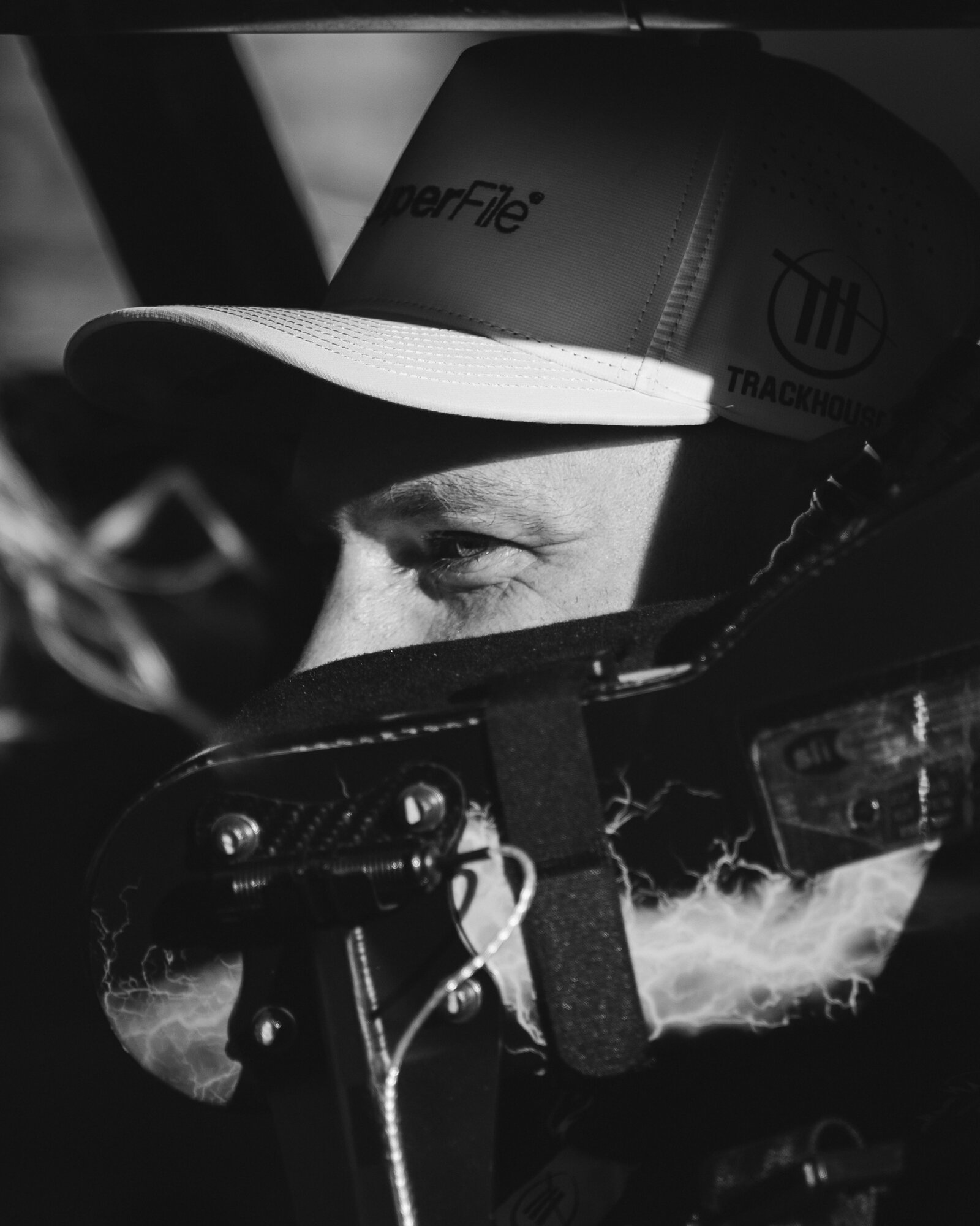 A driver focuses in the cockpit before the Go Bowling at The Glen