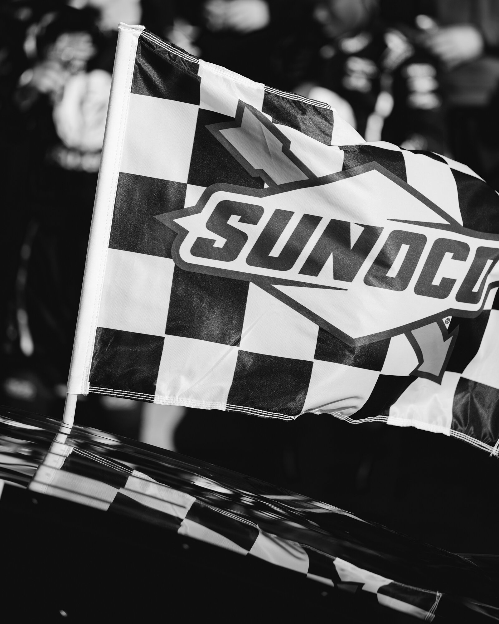 Checkered flag flies over Sunoco victory lane at Watkins Glen International
