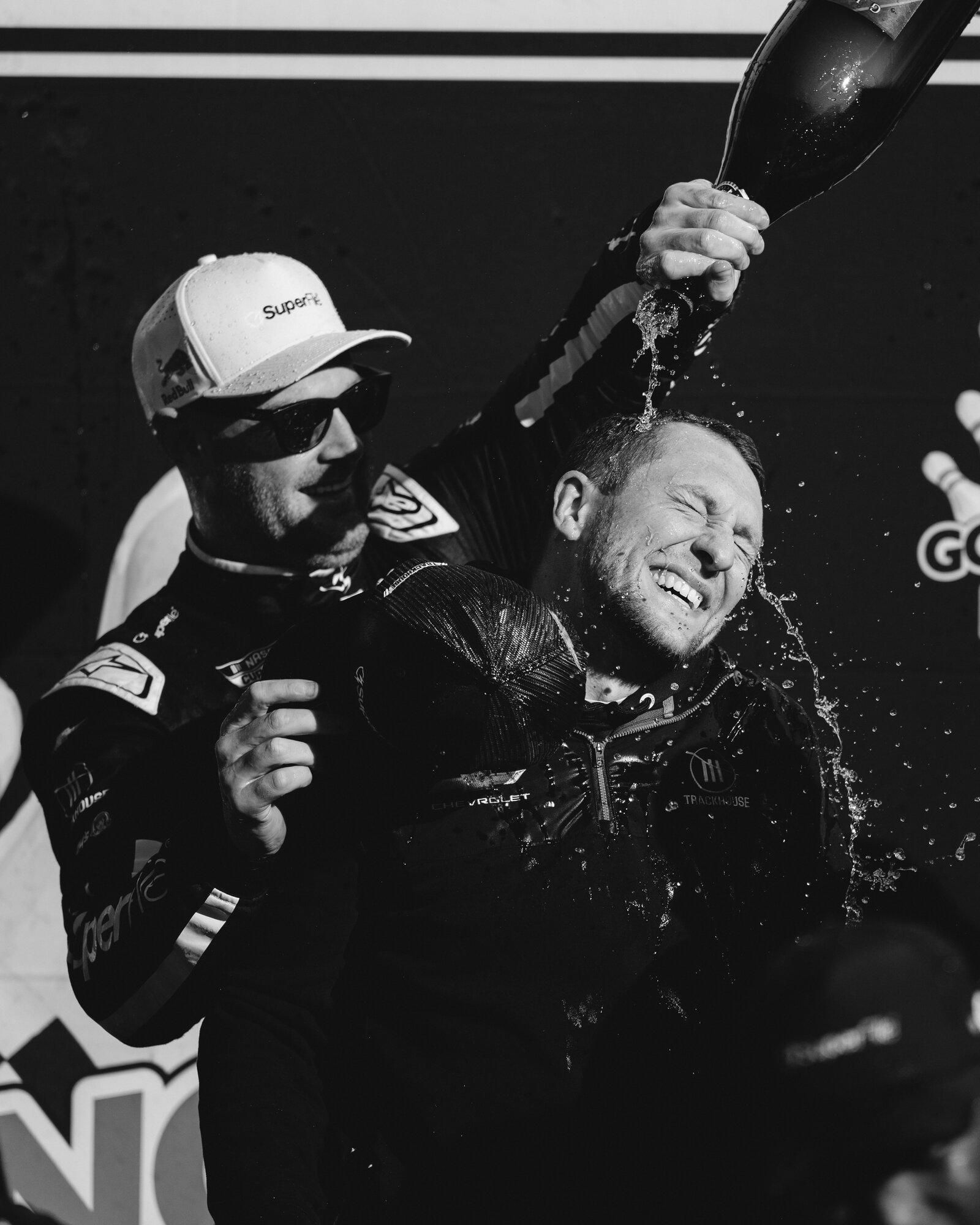 Shane van Gisbergen celebrates with champagne after winning the Go Bowling at The Glen