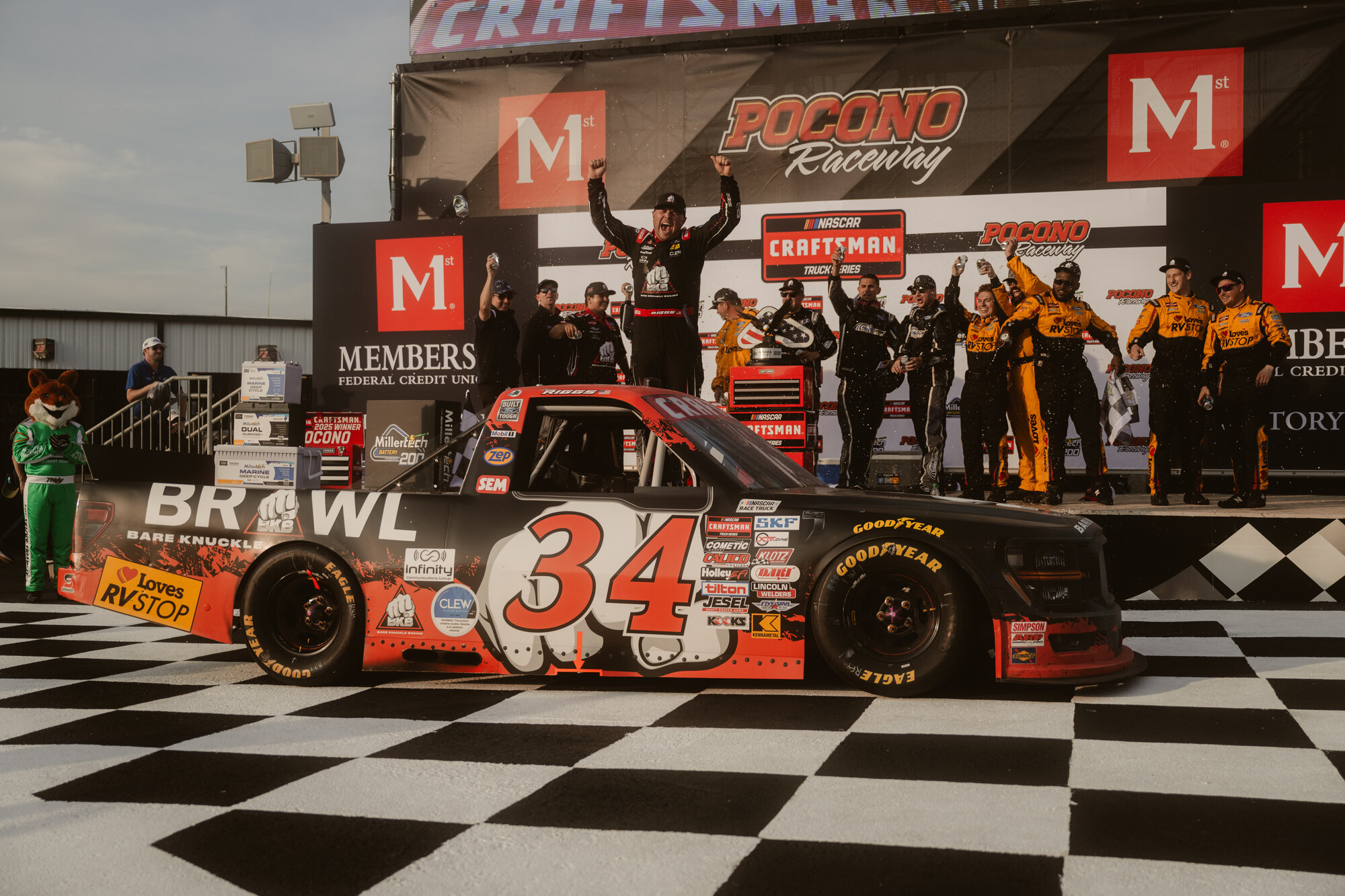 Layne Riggs celebrates in victory lane at Pocono Raceway