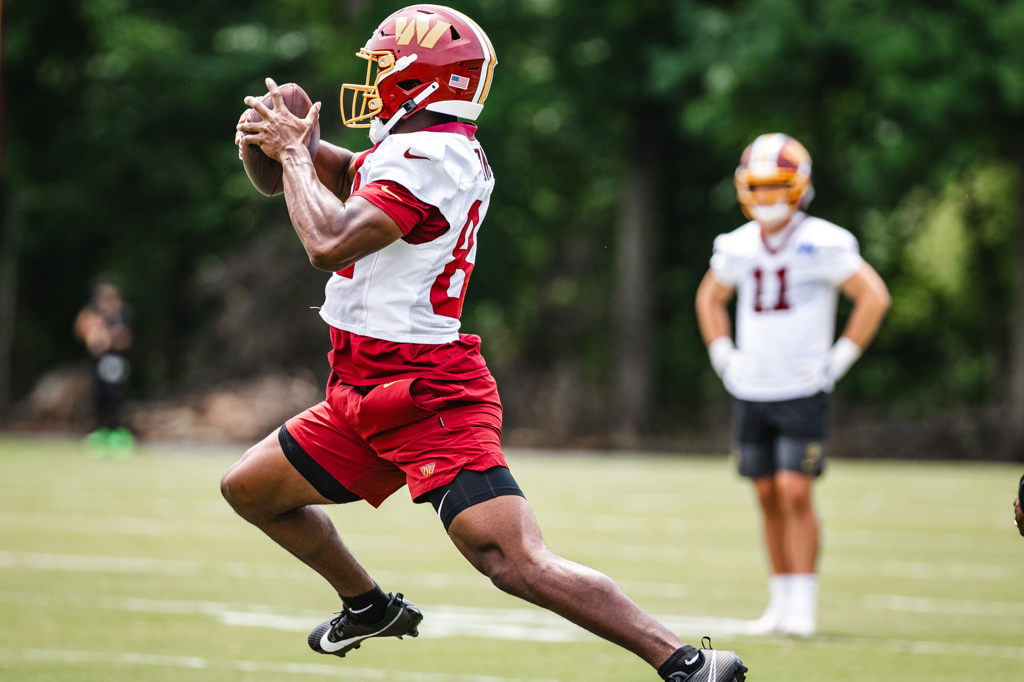Washington Commanders wide receiver Chris Hilton Jr. makes a catch during OTA Session 3
